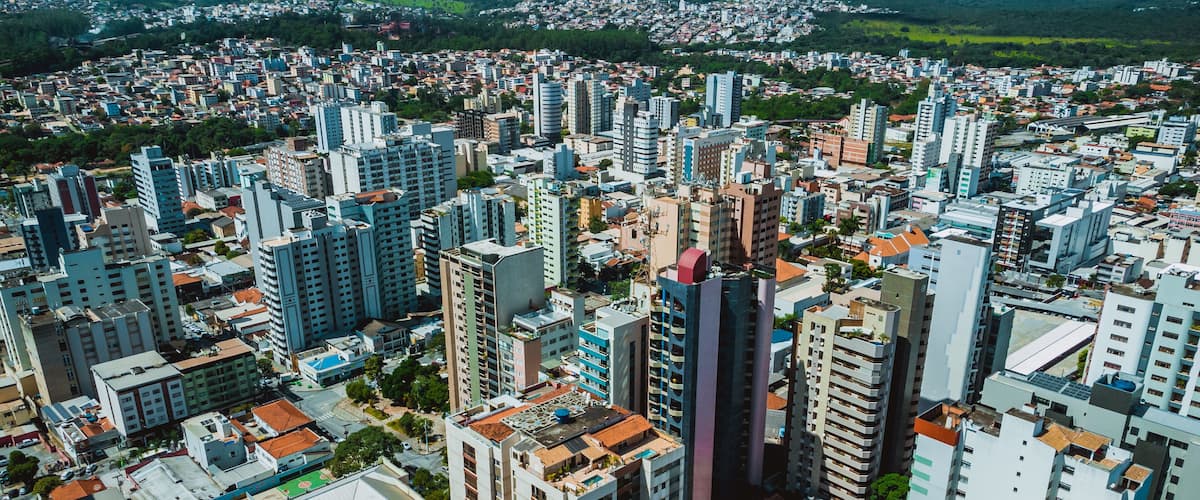 A densely packed urban area with numerous high-rise buildings and a mix of residential and commercial structures.