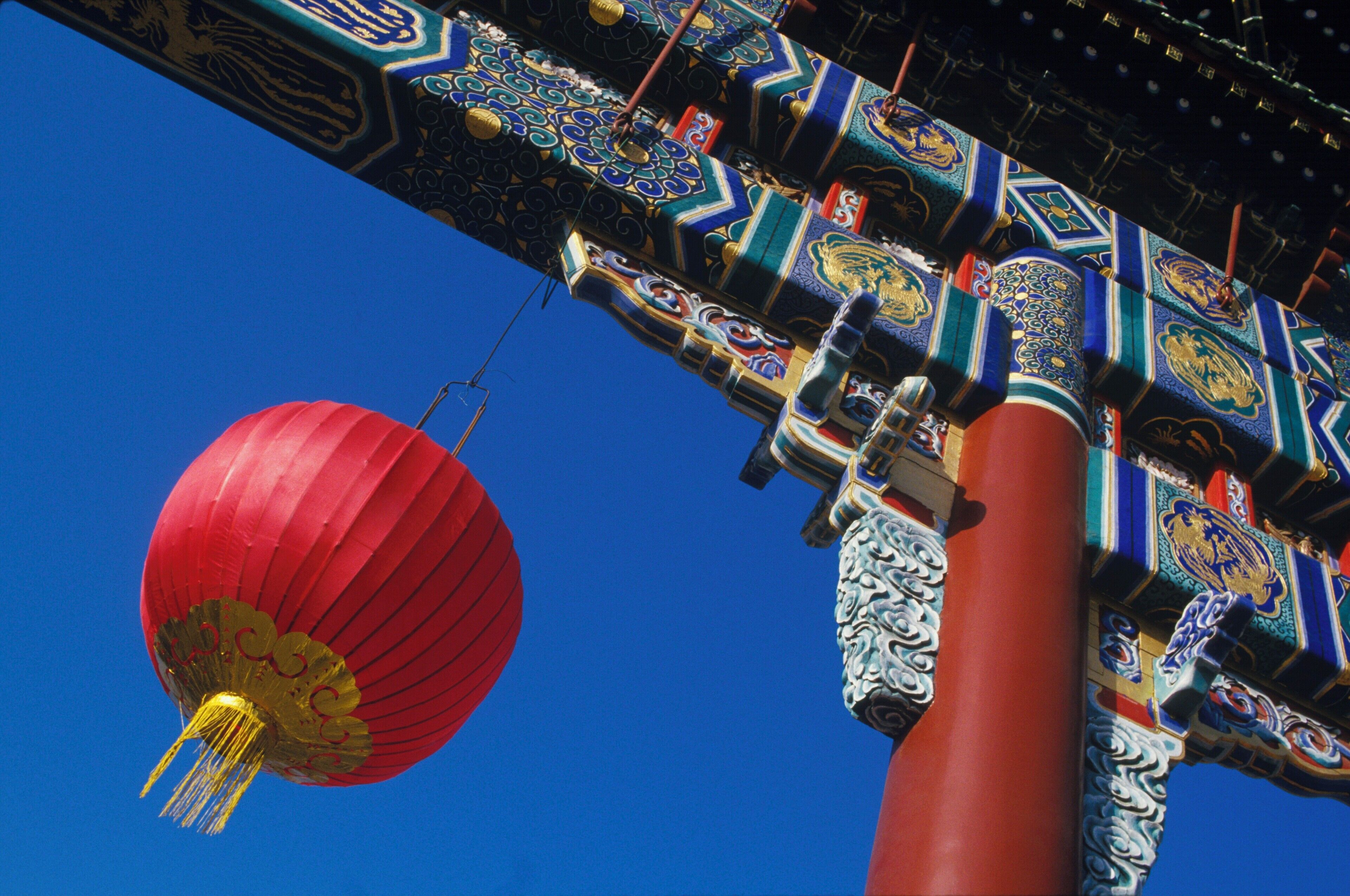 Low angle view of a lamp hanging from a column, China