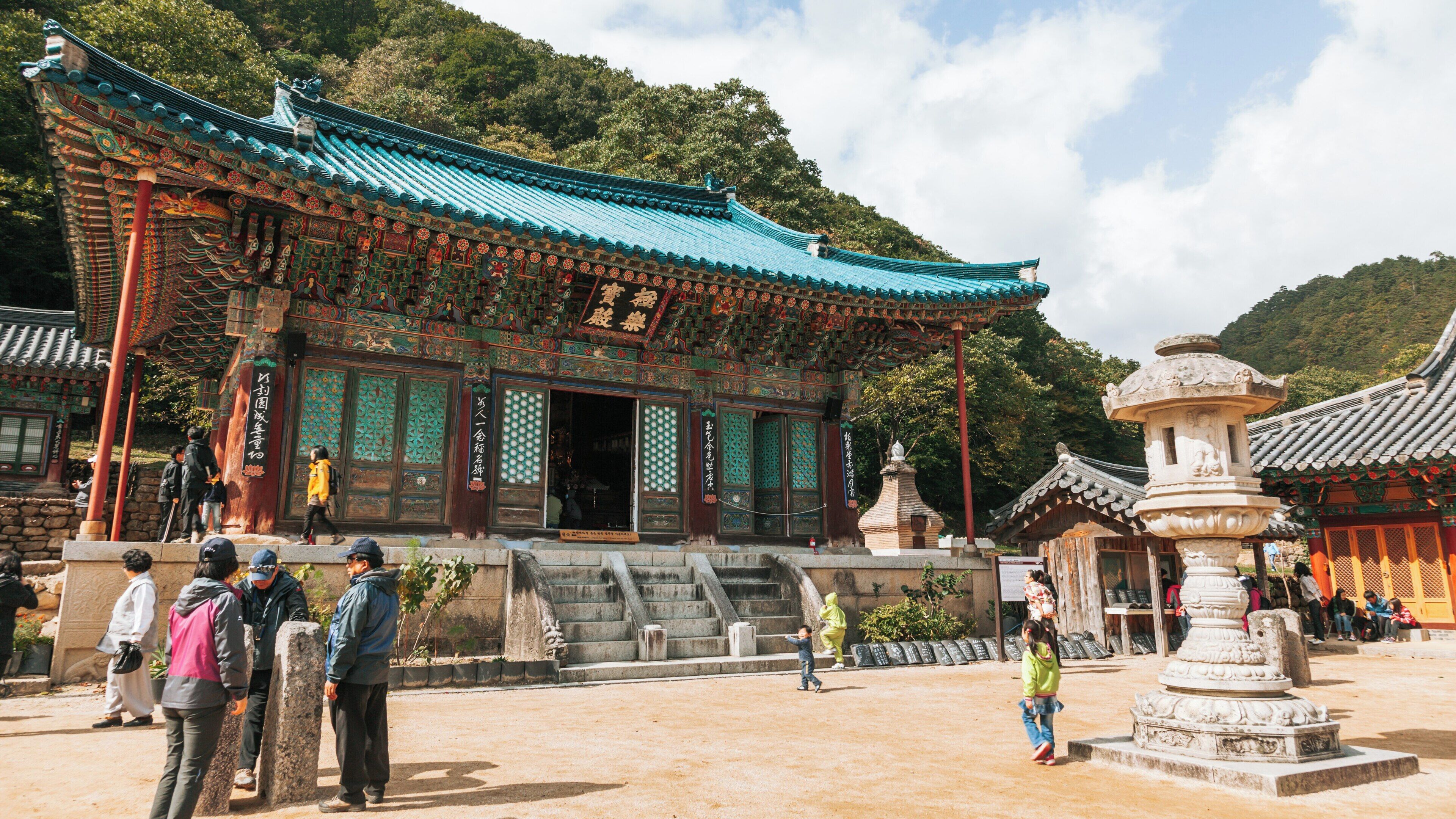 Visit to Sinheungsa Temple in Seorak-dong, Sokcho during a sunny day with visitors exploring the historic site in Gangwon, South Korea