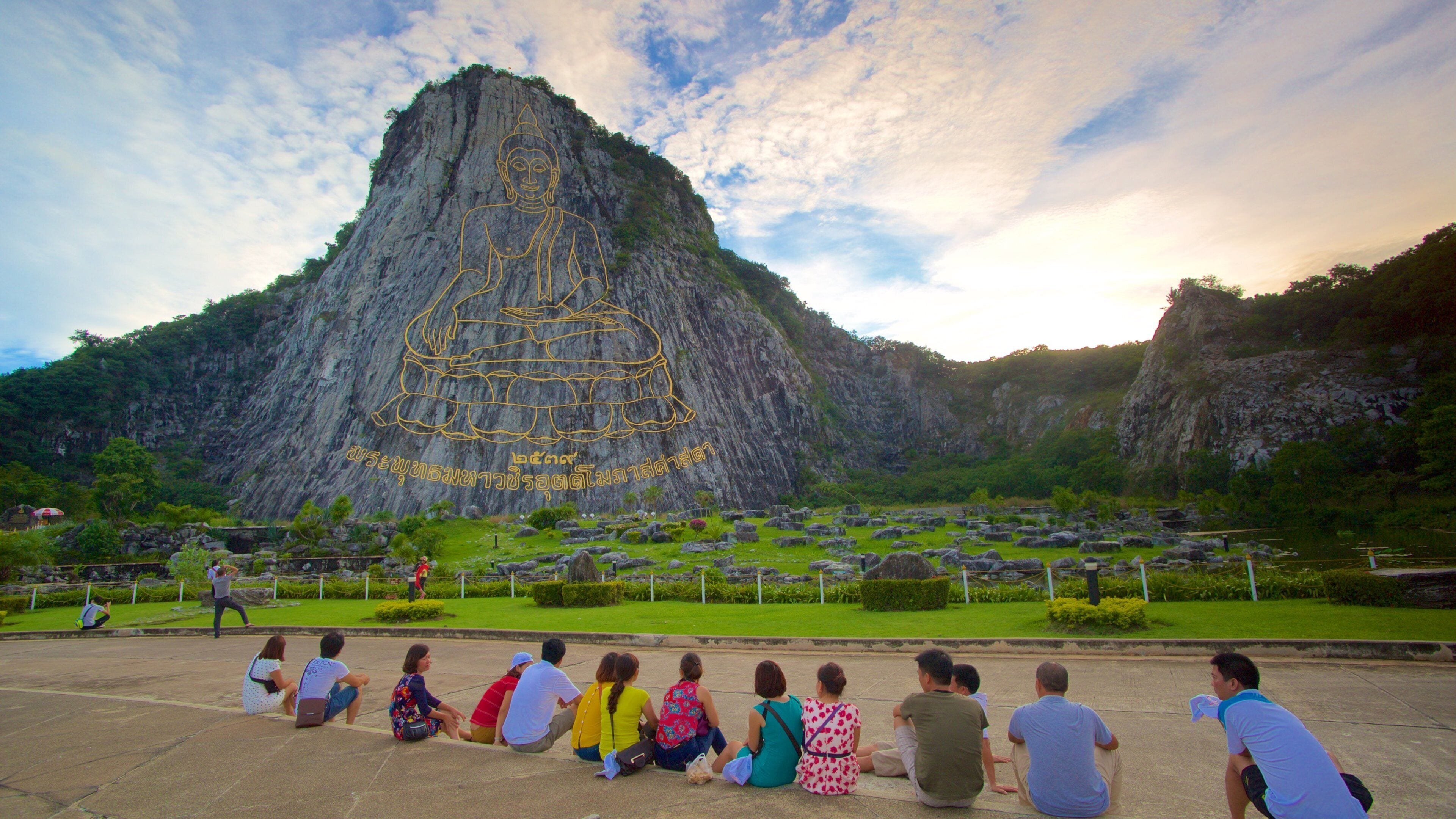 Buddha Mountain which includes mountains and religious elements as well as a large group of people