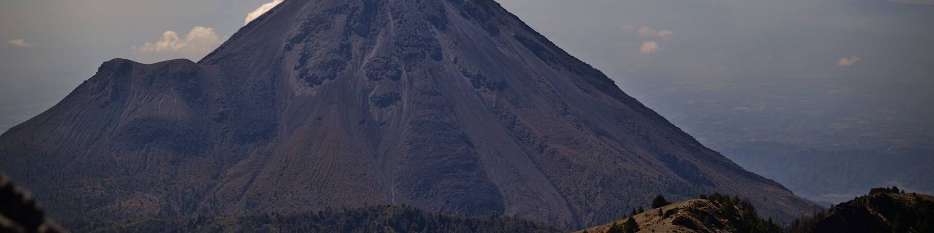 Aerial shot of the huge volcano in Guzman city Mexico against the blue sky