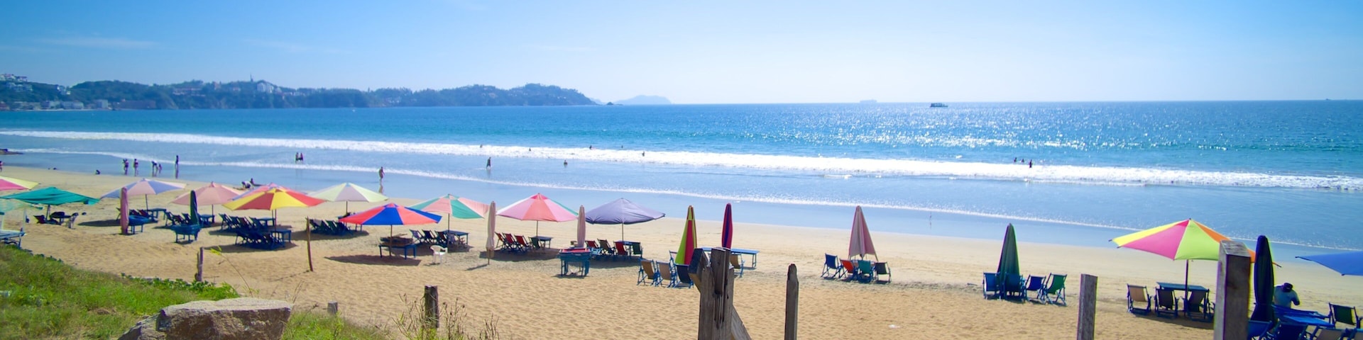Oro Beach which includes general coastal views and a sandy beach