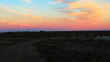 Get away from the world at Bahia Bustamante on the Argentinian coast, an old seaweed town come sheep estancia come small hotel. With a private penguin colony, petrified forest, horse rides along the beach and sunsets like this to yourself, this place is unforgettable.
http://www.nytimes.com/2011/03/06/travel/06bahia-bustamante.html?_r=0