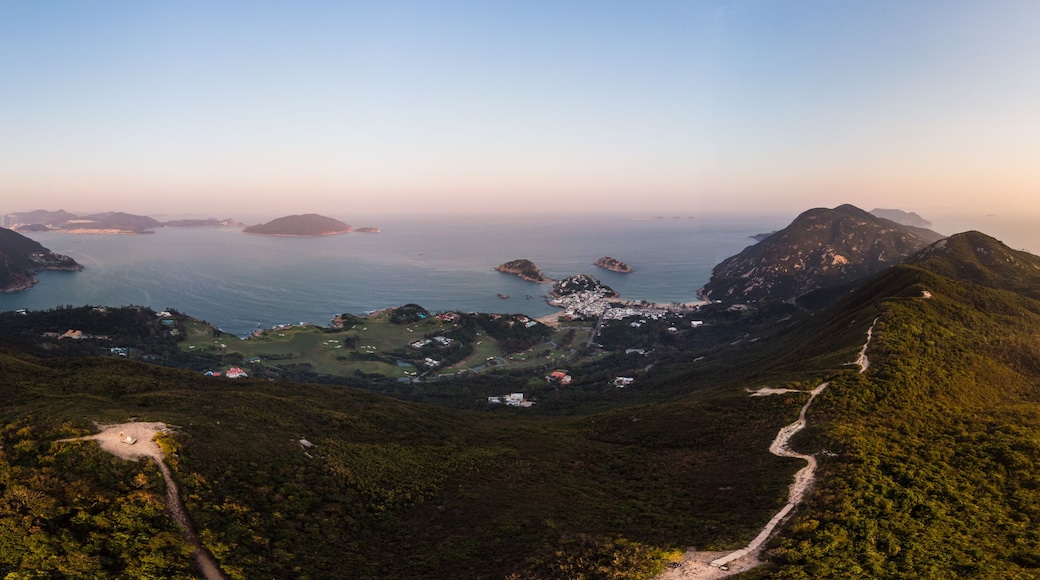 Aerial view of the sunset over the famous Dragon's back hiking trail and the Shek O village in the wild south part of Hong Kong island
