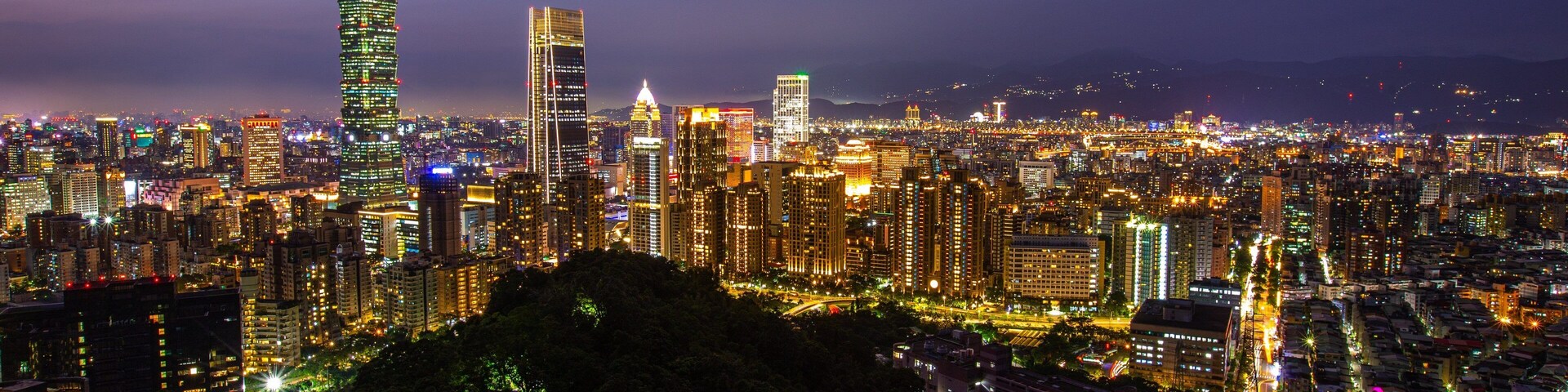 Elephant Mountain showing night scenes, a city and landscape views