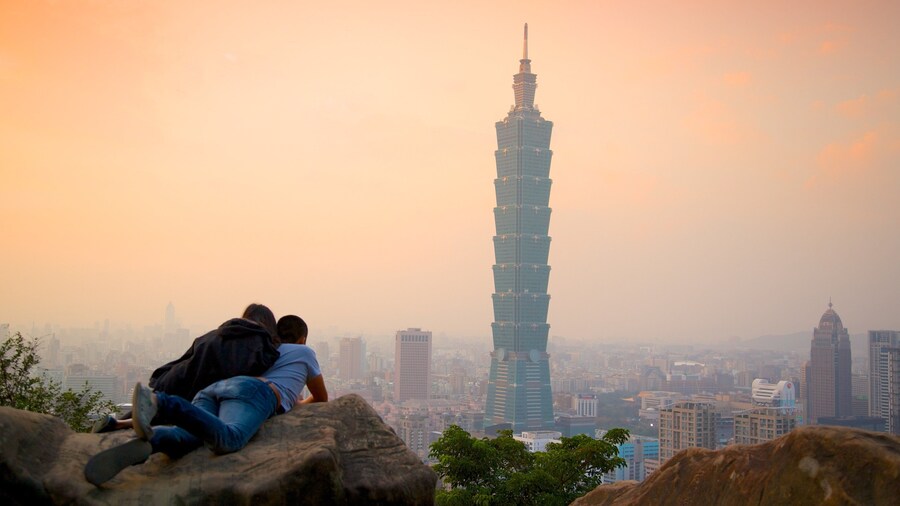 Taipei 101 featuring mist or fog, modern architecture and a high-rise building