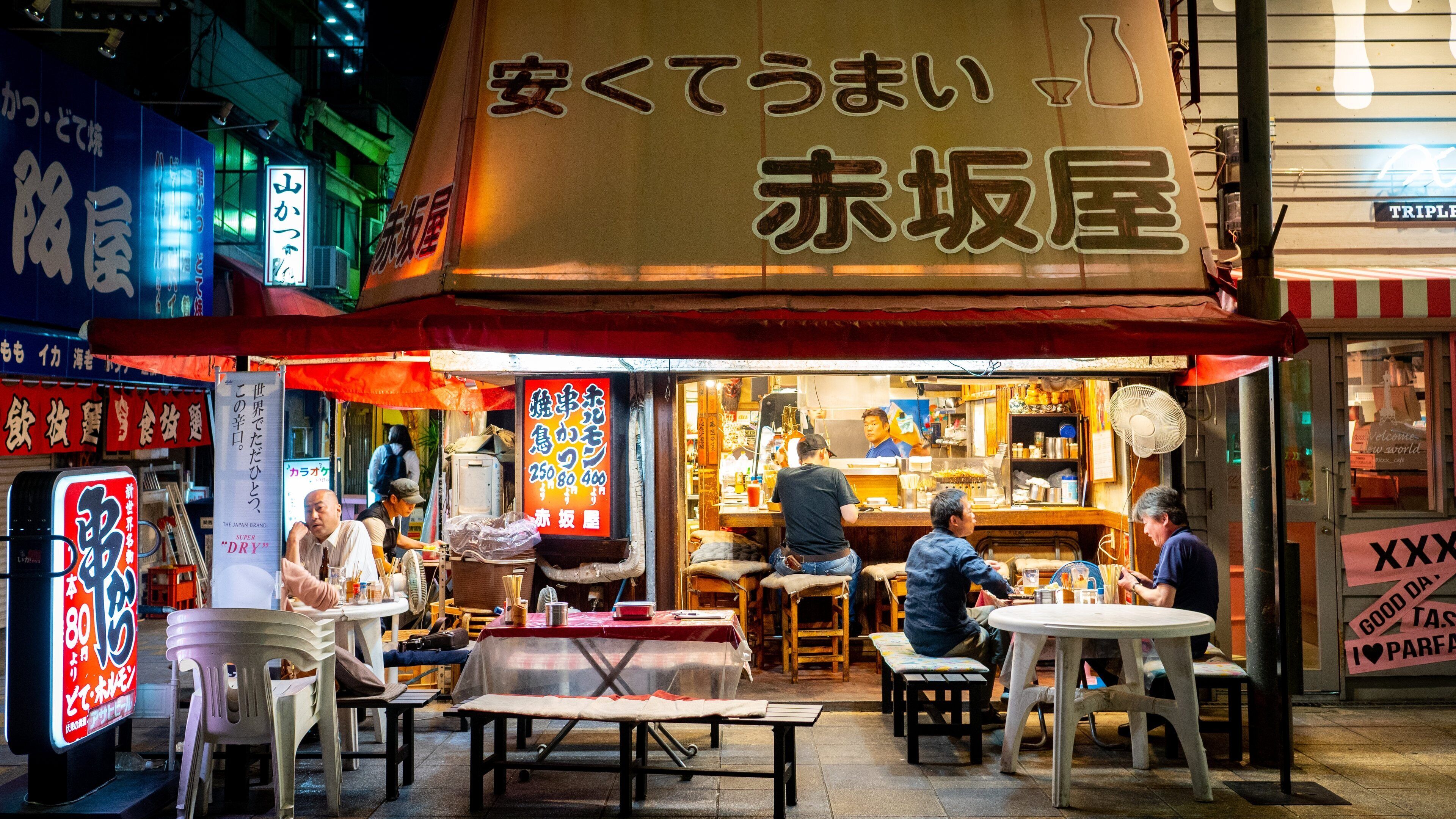 Shinsekai featuring night scenes, street scenes and outdoor eating