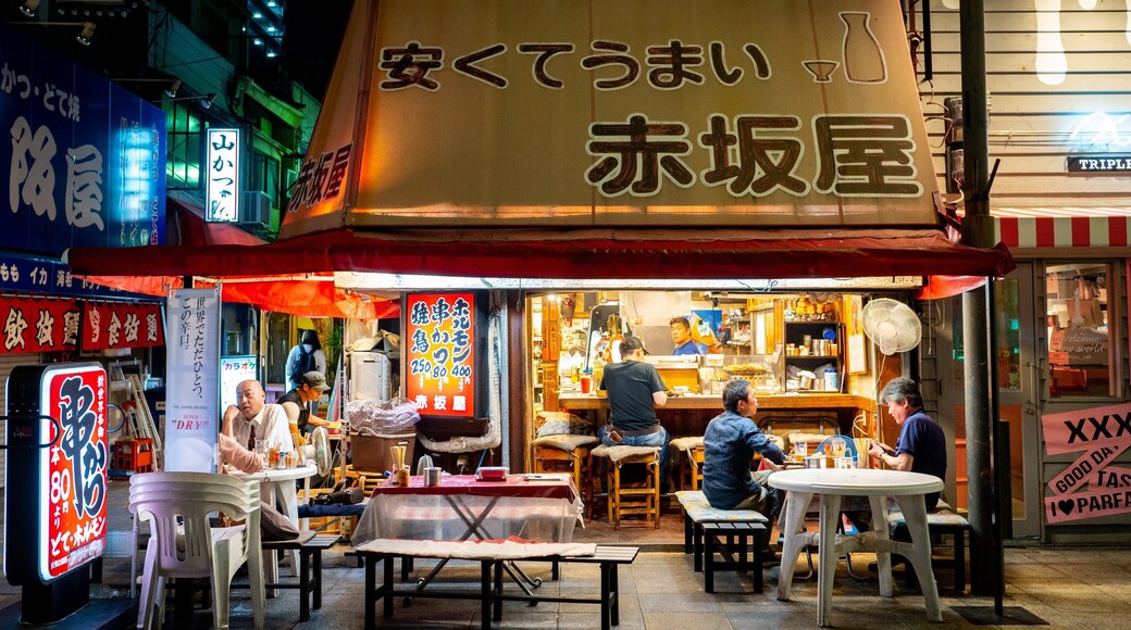 Shinsekai featuring night scenes, street scenes and outdoor eating