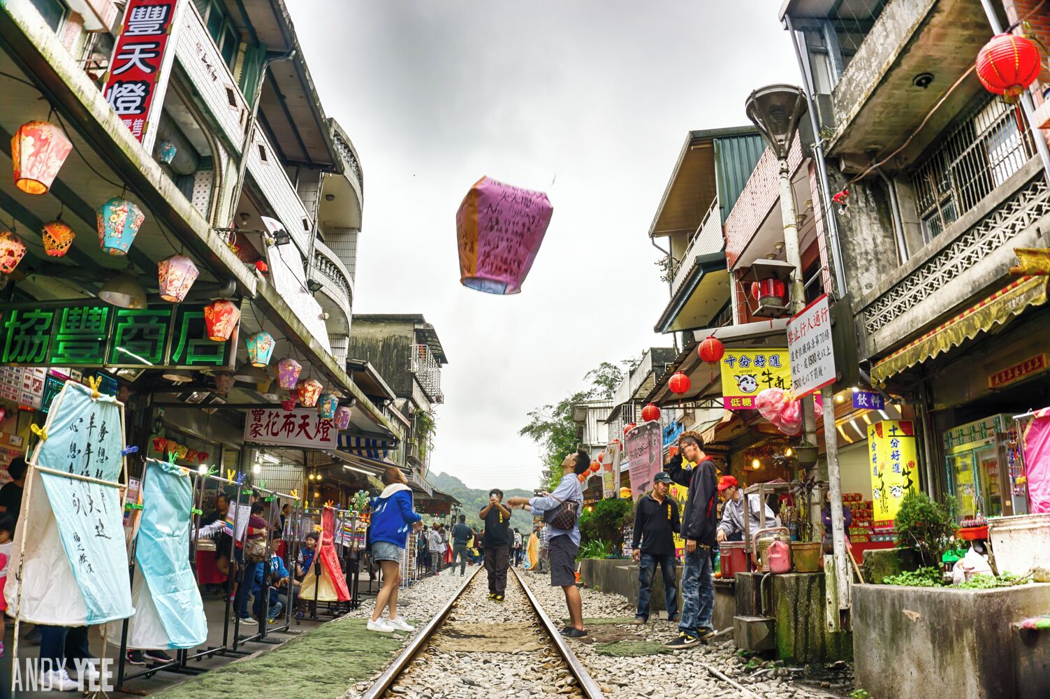 Shifen Old street is, well, technically also an active train line. Famous for being a tourist hot spot, the majority of visitors to this small town still catch the train in from Taipei. People can be found playing around in the middle of the train tracks, shopping, snacking on local delicacies and releasing sky lanterns with written wishes on them.

When a train is approaching, you will hear whistles and the guards will clear the track so that the train can pass through. Once its safe again, people return to enjoying this unique colourful experience.

‪#‎troveon‬ ‪#‎traveltherenext‬ ‪#‎shifen‬ ‪#‎taiwan‬ @traveltherenext @qftravelinsider