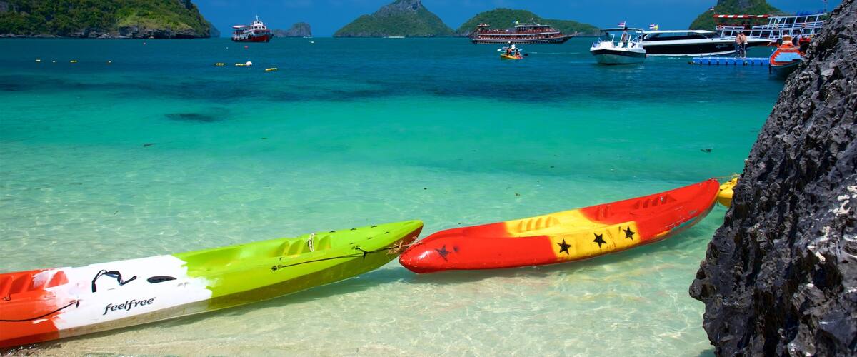 Koh Samui which includes a beach, rugged coastline and boating