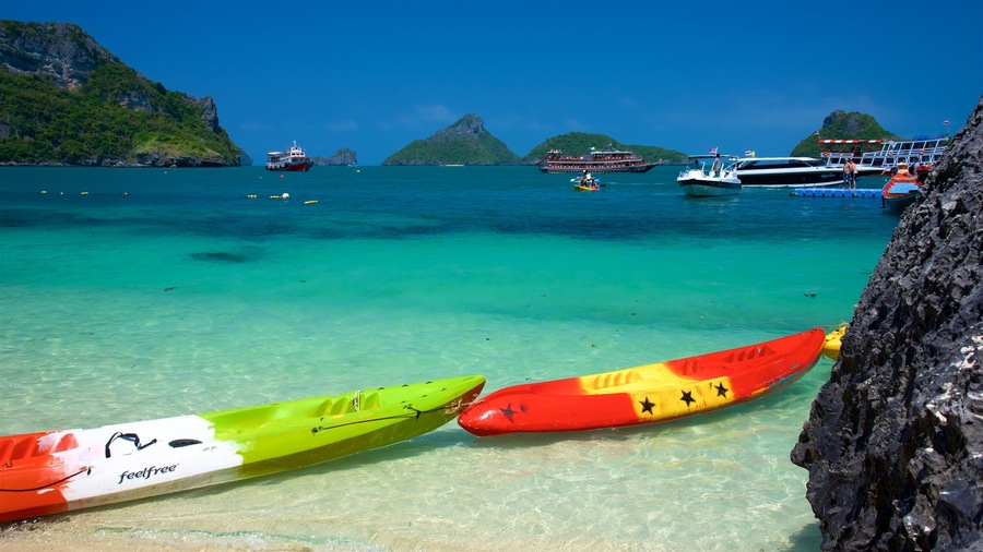 Koh Samui showing rugged coastline, a sandy beach and kayaking or canoeing