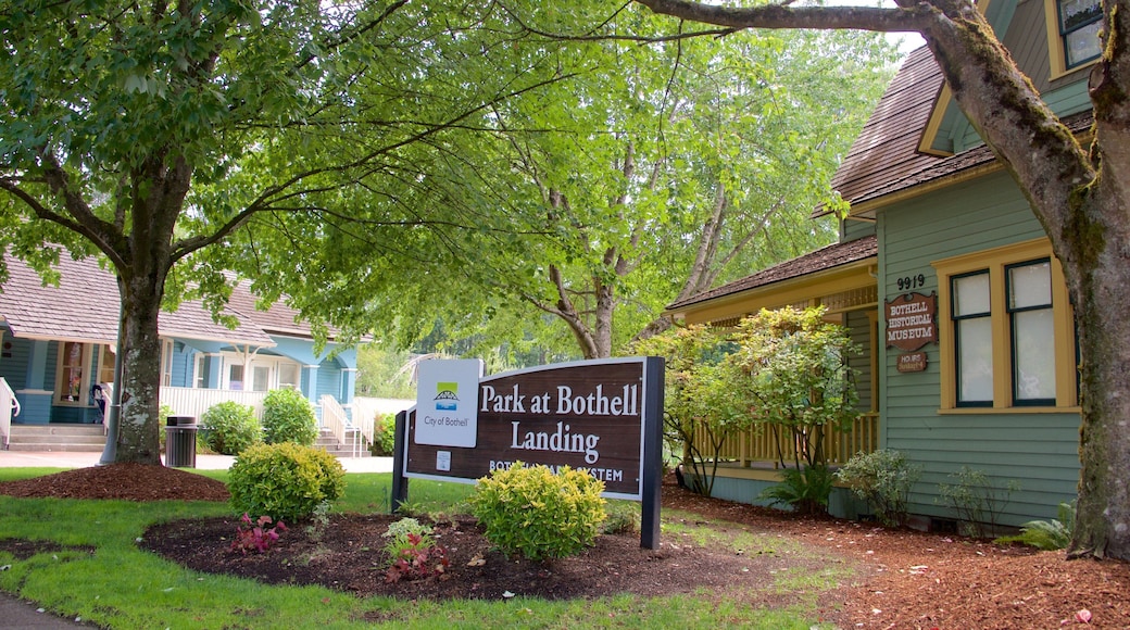 Park at Bothell Landing showing signage and a garden