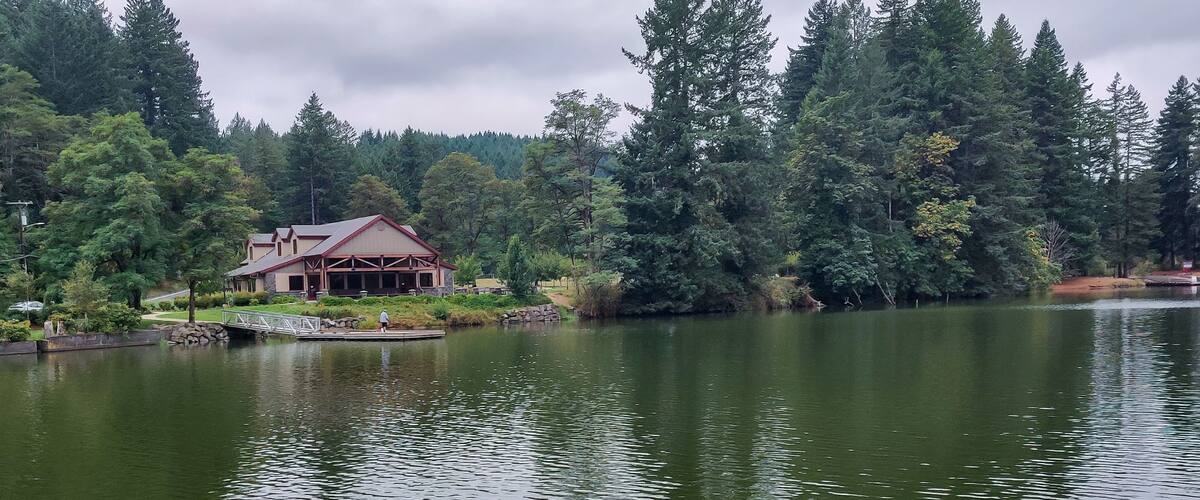 Wonderful Lacamas Lake on a breezy cloudy morning with the wilderness reflecting in the calm shimmering water in Camas Washington