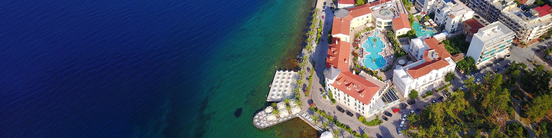 Aerial drone ultra wide photo of famous seaside village well known for thermal springs of Aidipsos, North Evia island, Greece