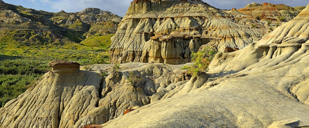 A rugged landscape with prominent rock formations and a clear blue sky.