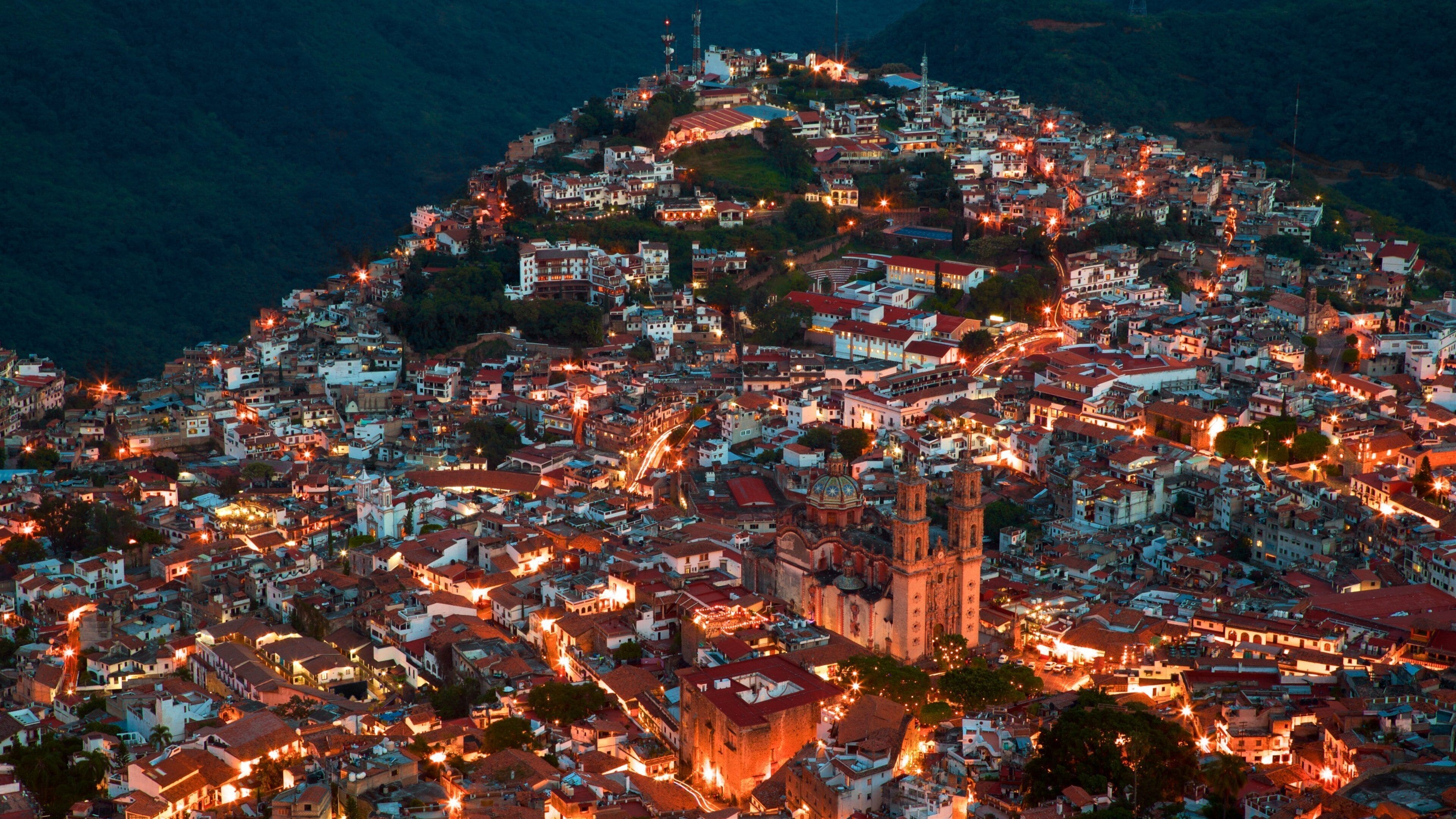 Santa Prisca Cathedral which includes a city and night scenes