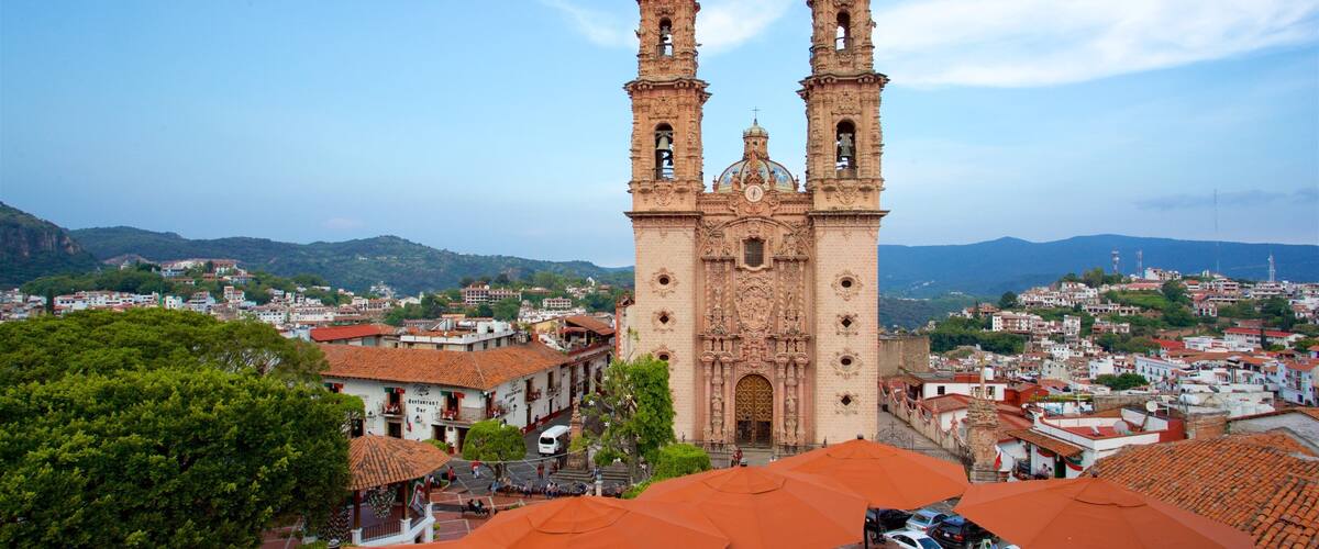Santa Prisca Cathedral showing a church or cathedral, a city and heritage architecture