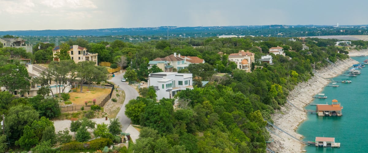 Lake Travis which includes general coastal views, landscape views and a coastal town