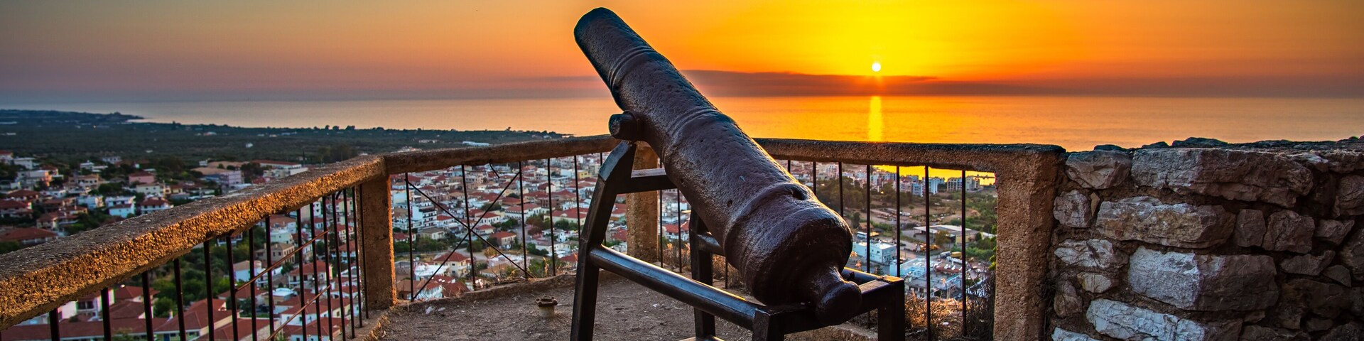 Beautiful sunset view from the historical castle of Kyparissia coastal town at sunset. Located in northwestern Messenia, Peloponnese, Greece, Europe.