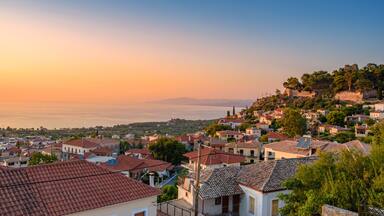 Sunset view over the picturesque coastal town of Kyparissia located in northwestern Messenia, Trifylia, Peloponnese, Greece.