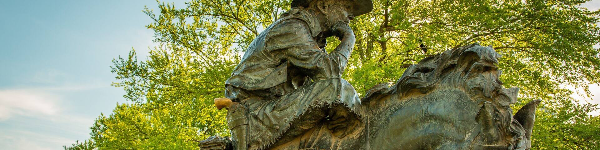 Pioneer Plaza which includes a statue or sculpture