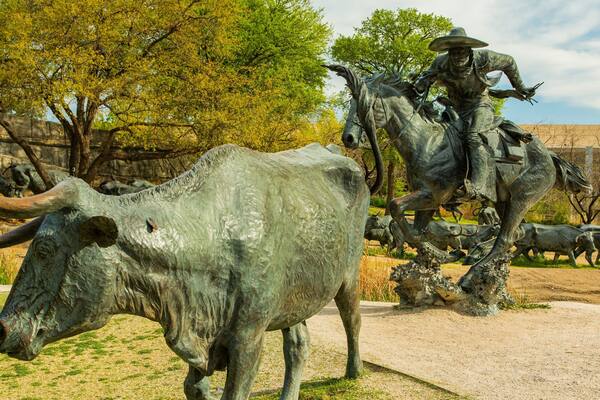 Pioneer Plaza featuring a statue or sculpture and outdoor art