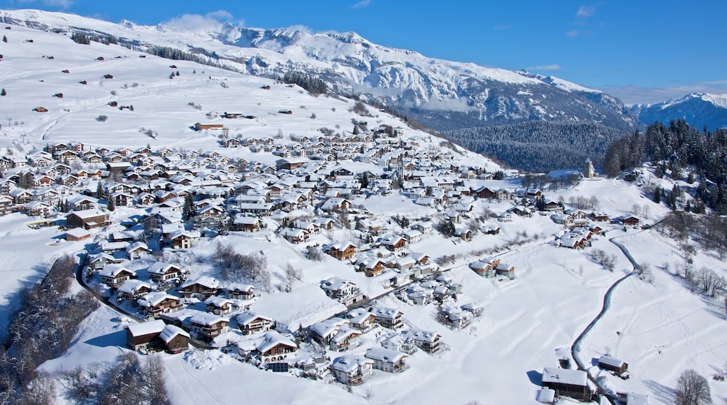 Laax which includes landscape views, snow and a small town or village