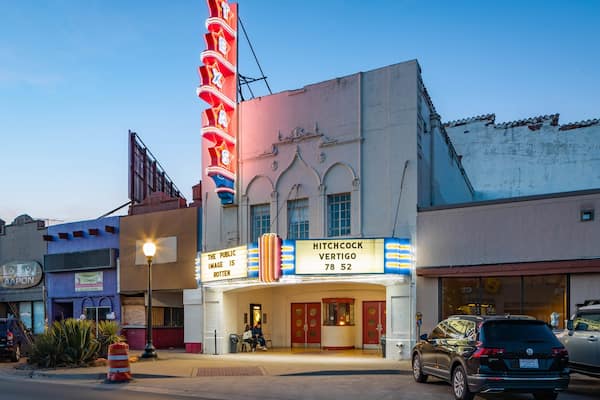 Texas Theatre showing signage and night scenes