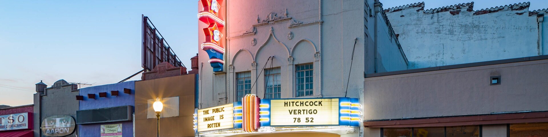 Texas Theatre showing signage and night scenes
