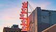 Texas Theatre which includes signage and a sunset