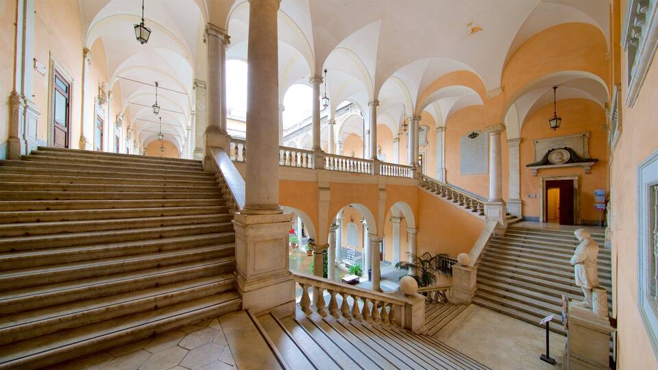 A grand staircase with multiple levels, ornate columns, and a balustrade.
