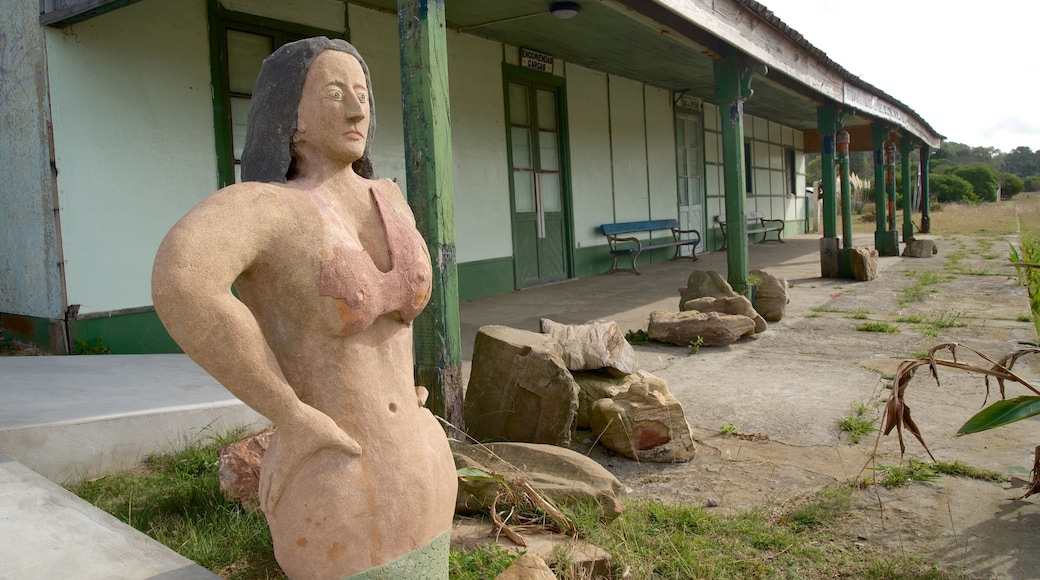 Rocha which includes a small town or village and a statue or sculpture