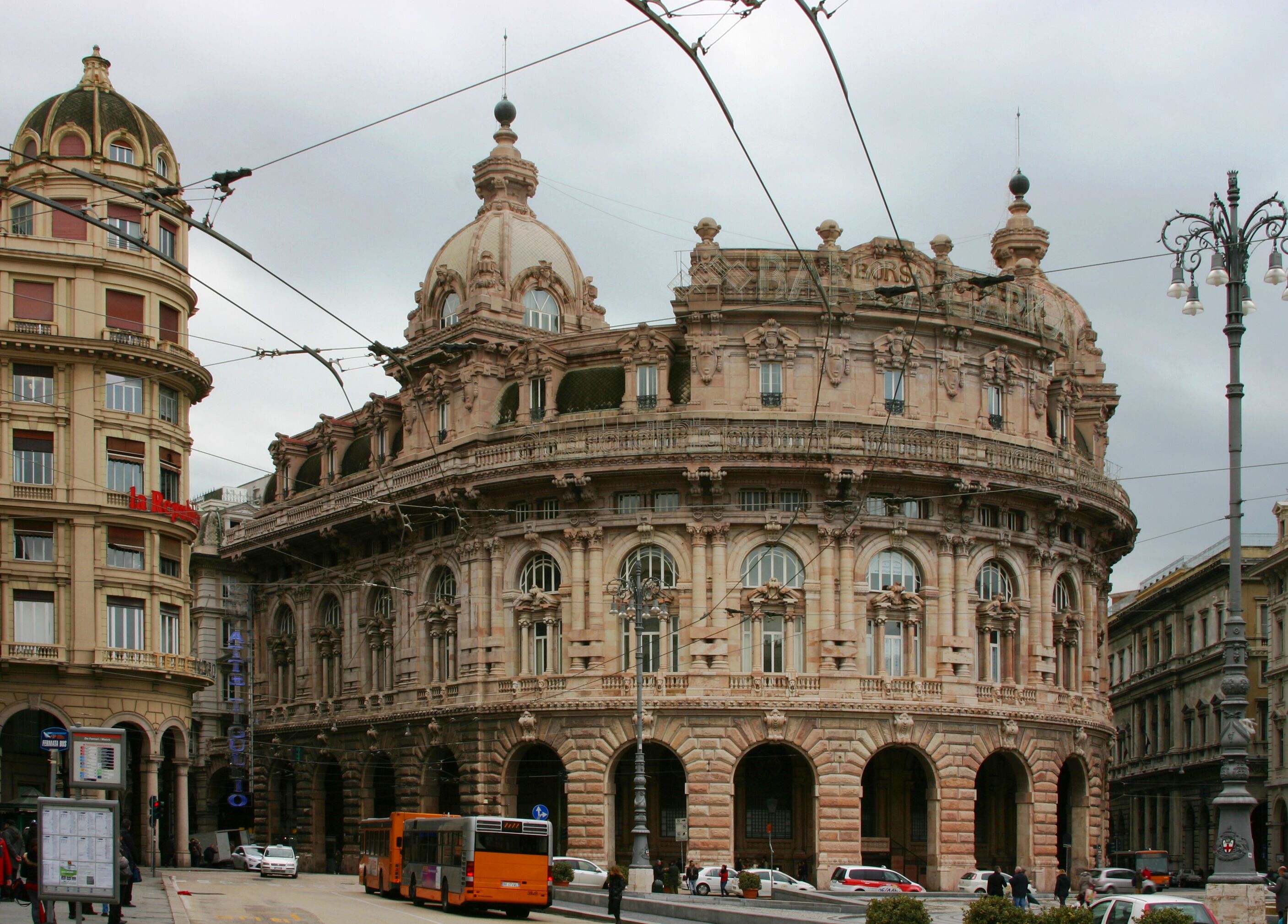 A historic building with ornate architecture, including a dome and multiple arches.