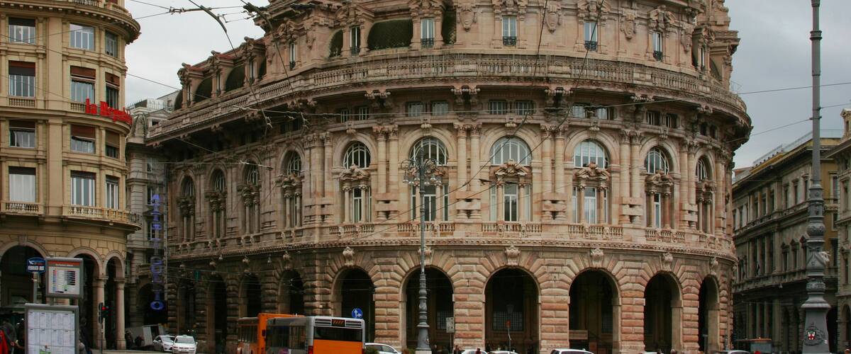 A historic building with ornate architecture, including a dome and multiple arches.