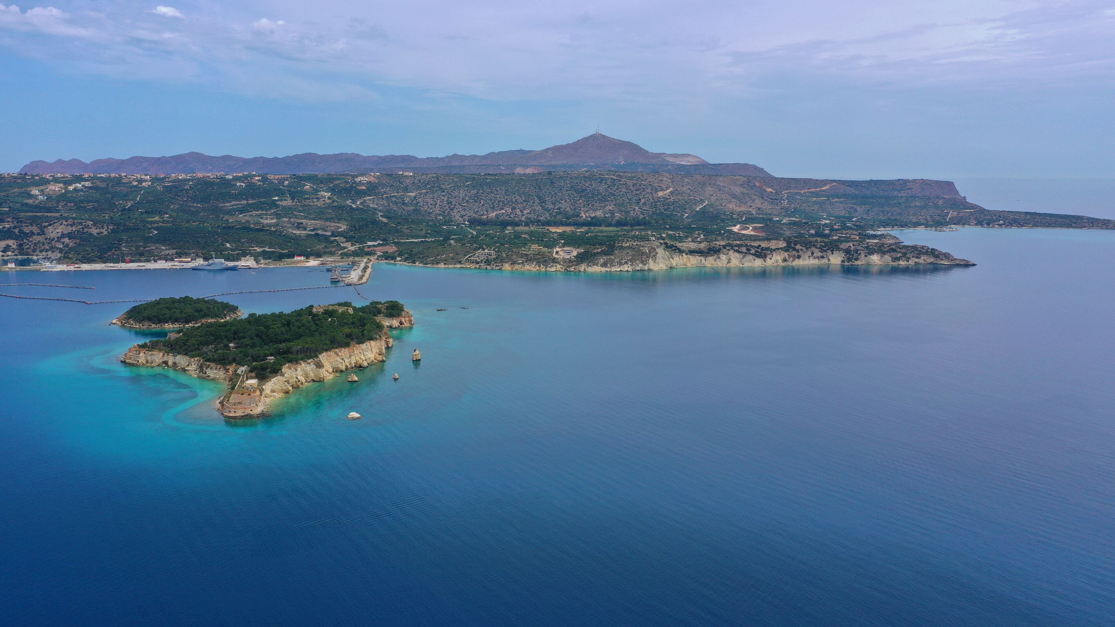 Aerial drone photo of famous Venetian fortified islet of Souda featuring small chapel of Agios Nikolaos, Chania, Crete island, Greece