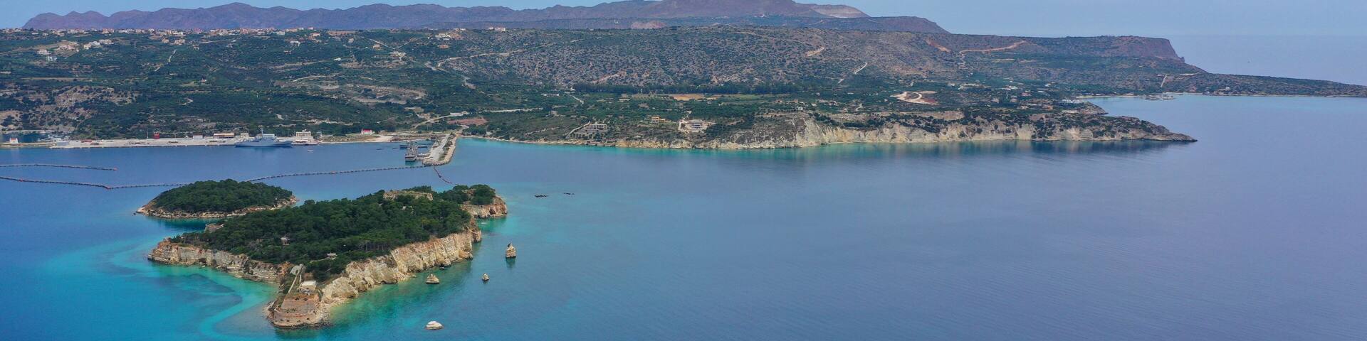 Aerial drone photo of famous Venetian fortified islet of Souda featuring small chapel of Agios Nikolaos, Chania, Crete island, Greece