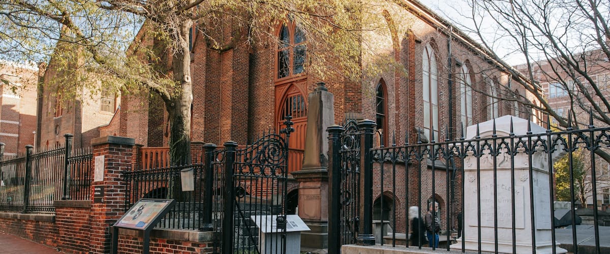 Edgar Allan Poe\'s Gravesite and Memorial showing heritage architecture and a cemetery