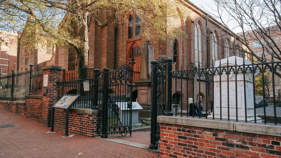 Edgar Allan Poe\'s Gravesite and Memorial showing heritage architecture and a cemetery