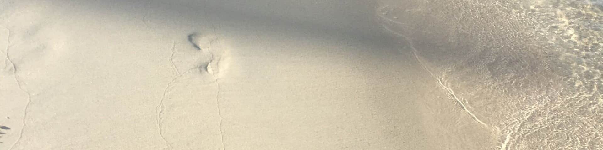 Warm waters lapping your feet, the softest white sand underfoot.