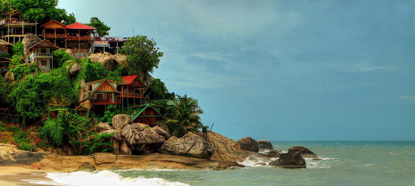 Even getting to this beach is not always easy, especially when the road is washed out, but you can also get here by boat or scooter if you're feeling adventurous.  
Simple, inexpensive beach view bungalows with unique designs, and sometimes a lot of steps. There's a small restaurant and bar up top, with a beautiful deck overlooking the sea. 
One of my favorite spots in Thailand.