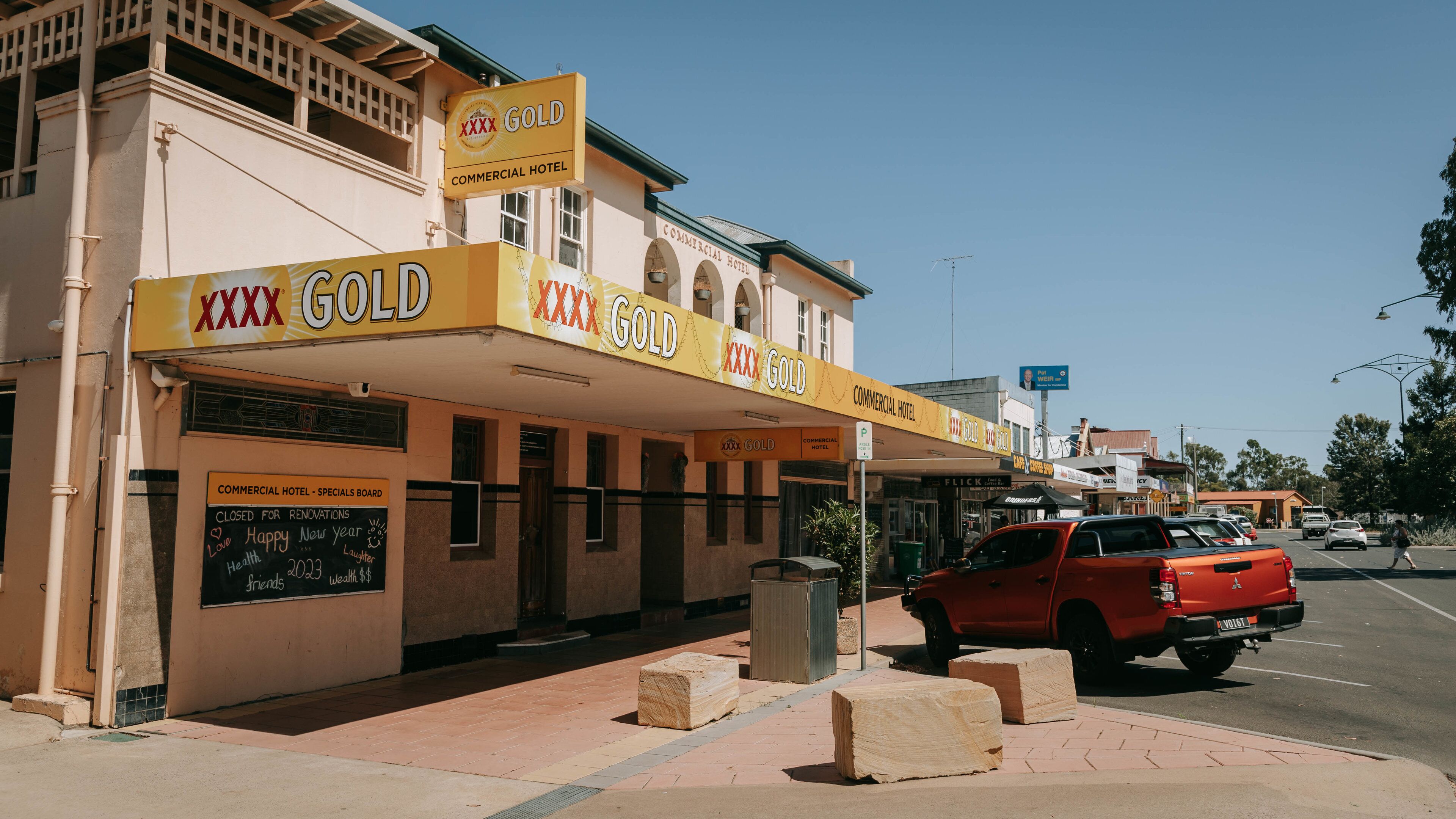Oakey which includes signage and a small town or village