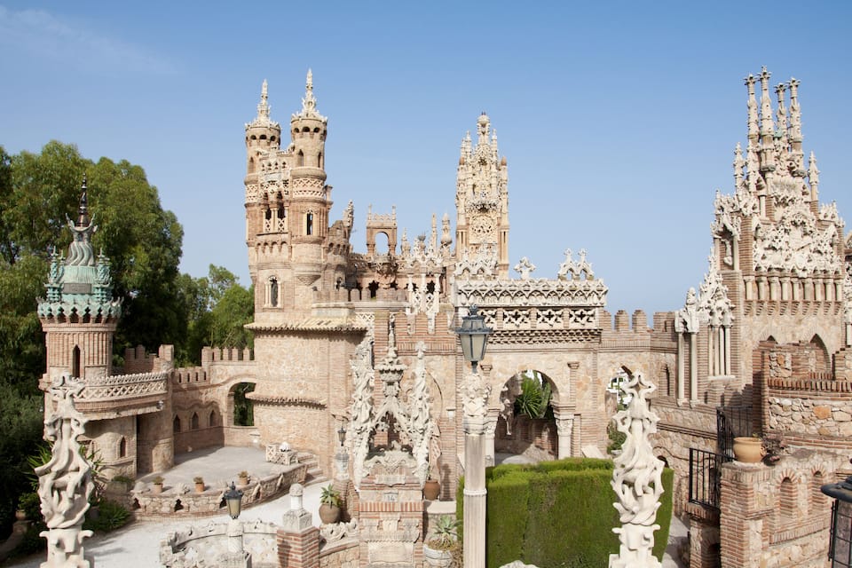 A detailed architectural model of a castle with intricate designs, including towers and arches.