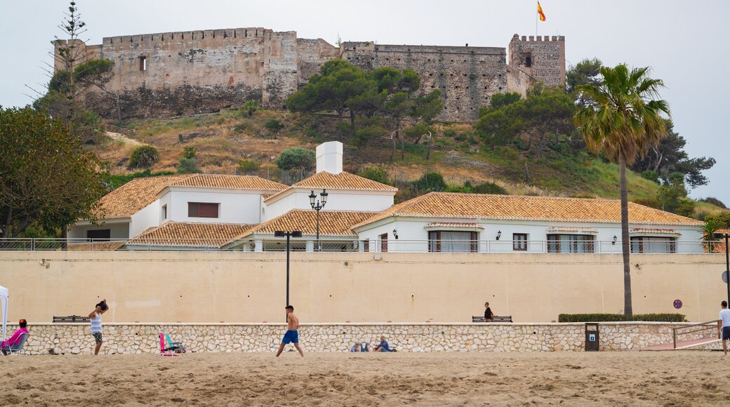 Sohail Castle showing chateau or palace, a coastal town and a beach