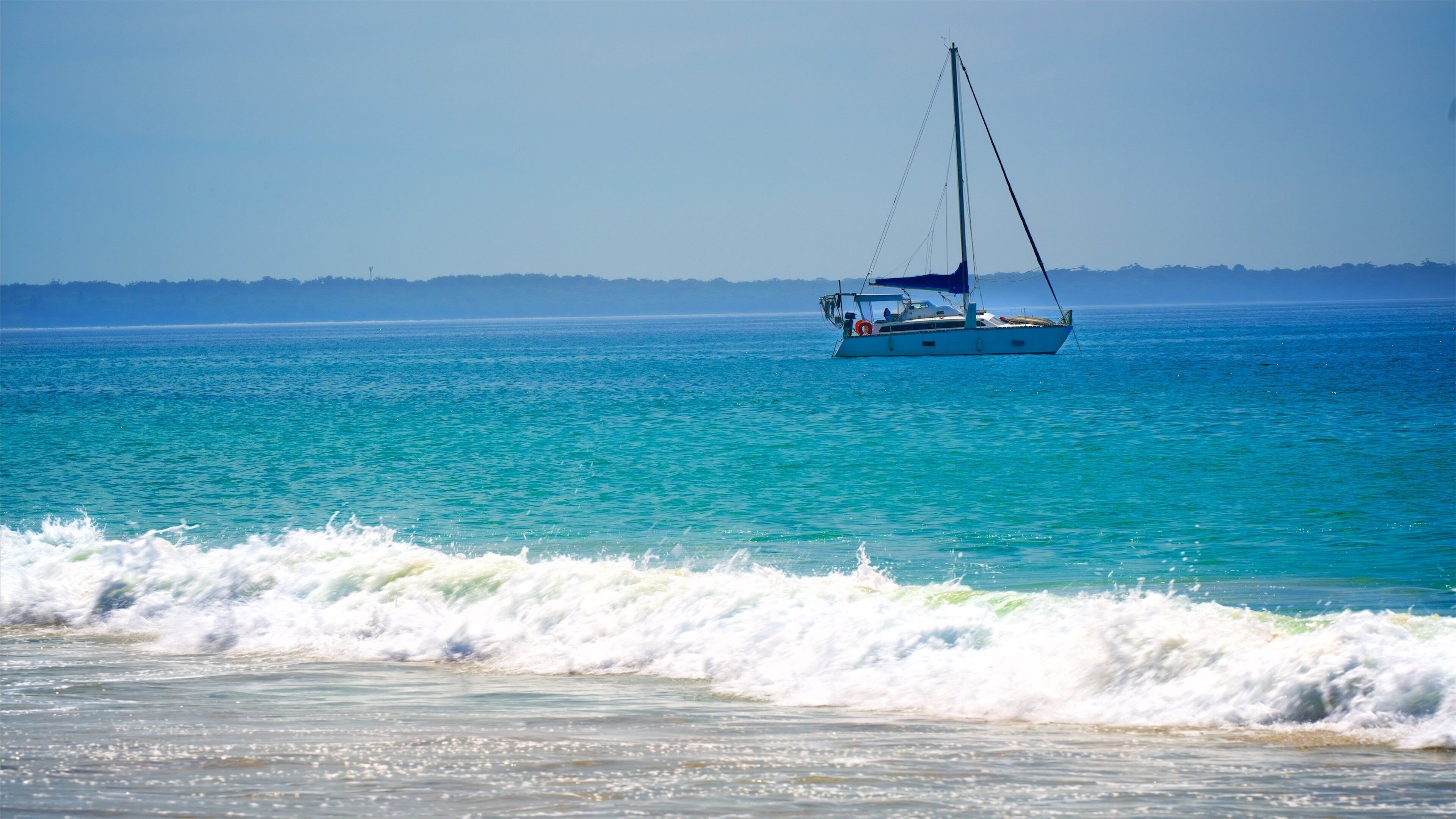 Collingwood Beach which includes a sandy beach, general coastal views and boating