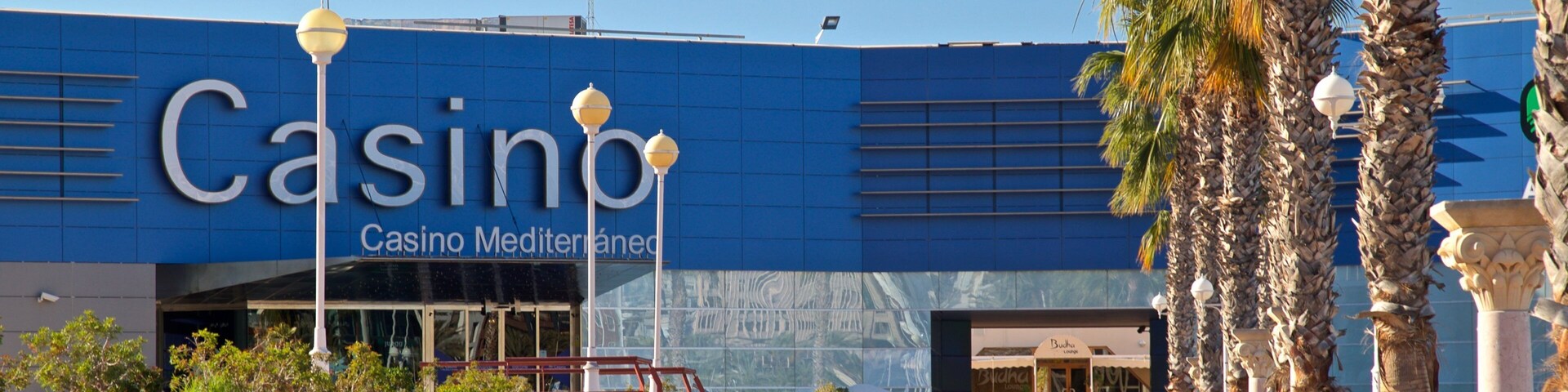 Casino Mediterraneo showing signage as well as a small group of people