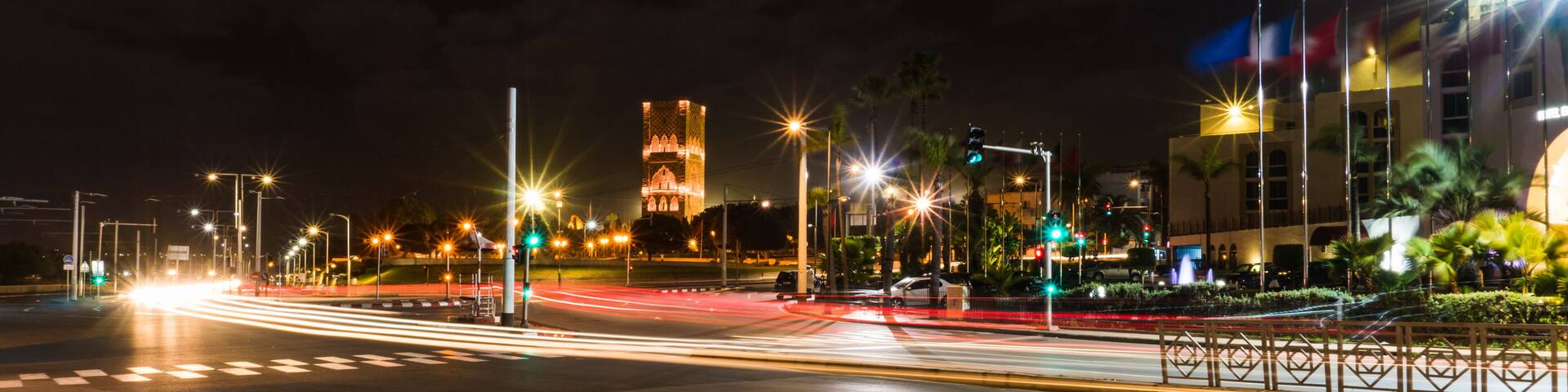Long Exposure shot of Night Road and car lights Tracks in Rabat, The capital of Morocco with Hassan tower on background