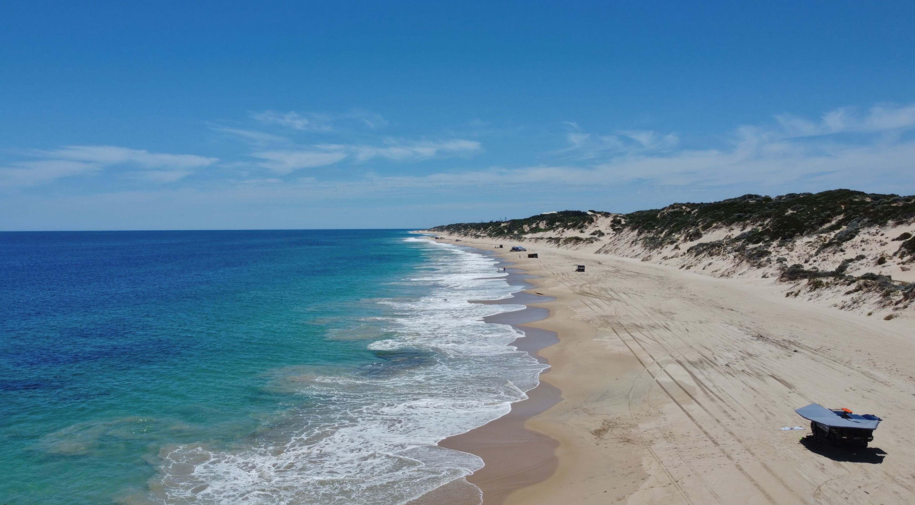 Drone, Christmas day, 4x4 driving (4WD) on Preston Beach, just south of Perth, Western Australia. Camp, swim and eat. Turquoise colored water, white sand dunes 