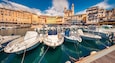 Attractive summer cityscape of Bastia port with twin-towered Church of St. Jean-Baptiste rising behind it. Splendid morning view of Corsica island, France, Europe. Beautiful Mediterranean seascape.