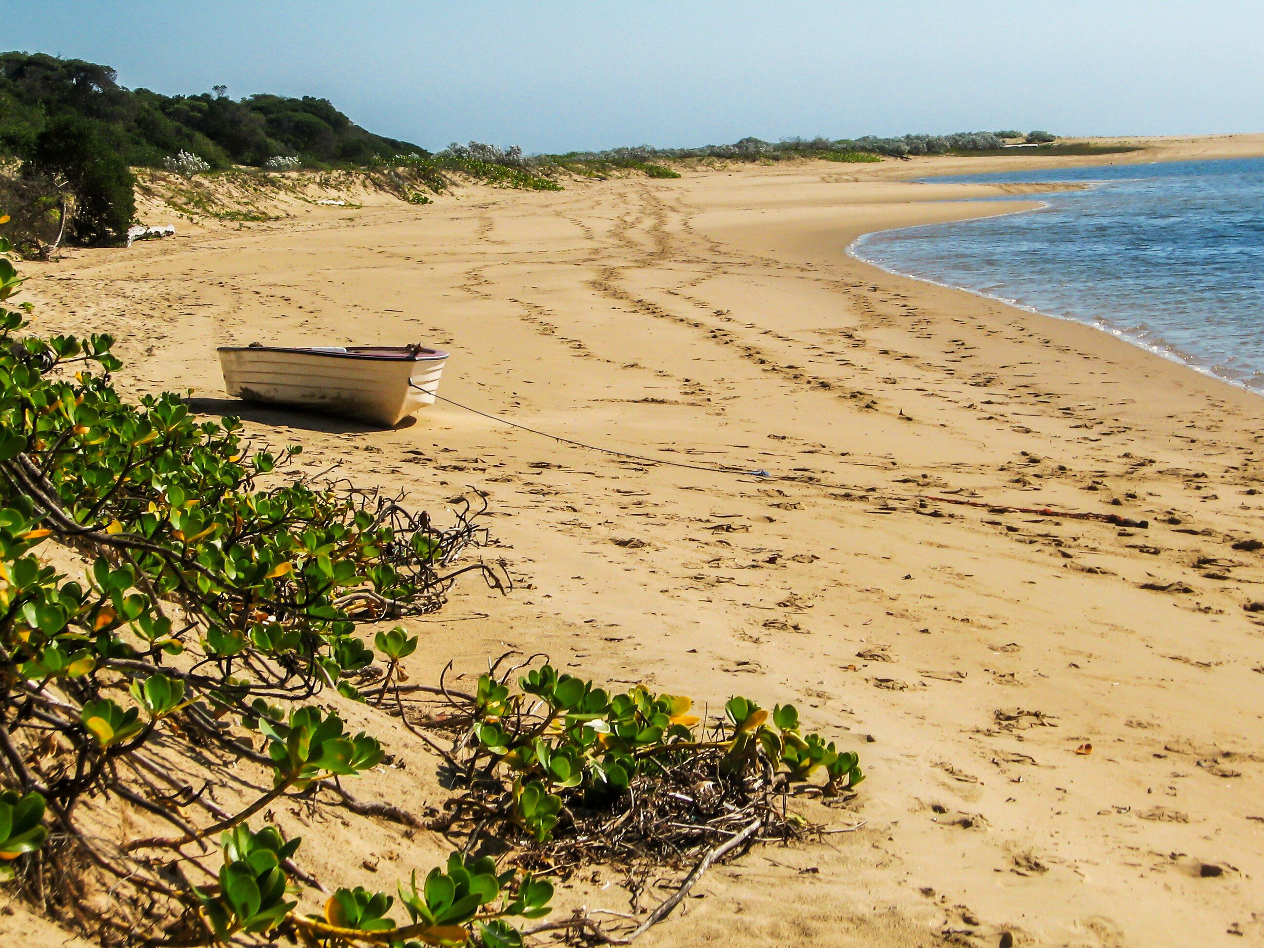 A small rowboat moored on the beach of a small sheltered bay in Portuguese Island, part of the Inhaca Barrier Island system, of the coast of Mozambique