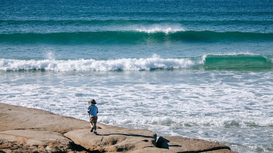 Bulcock Beach showing general coastal views as well as an individual child